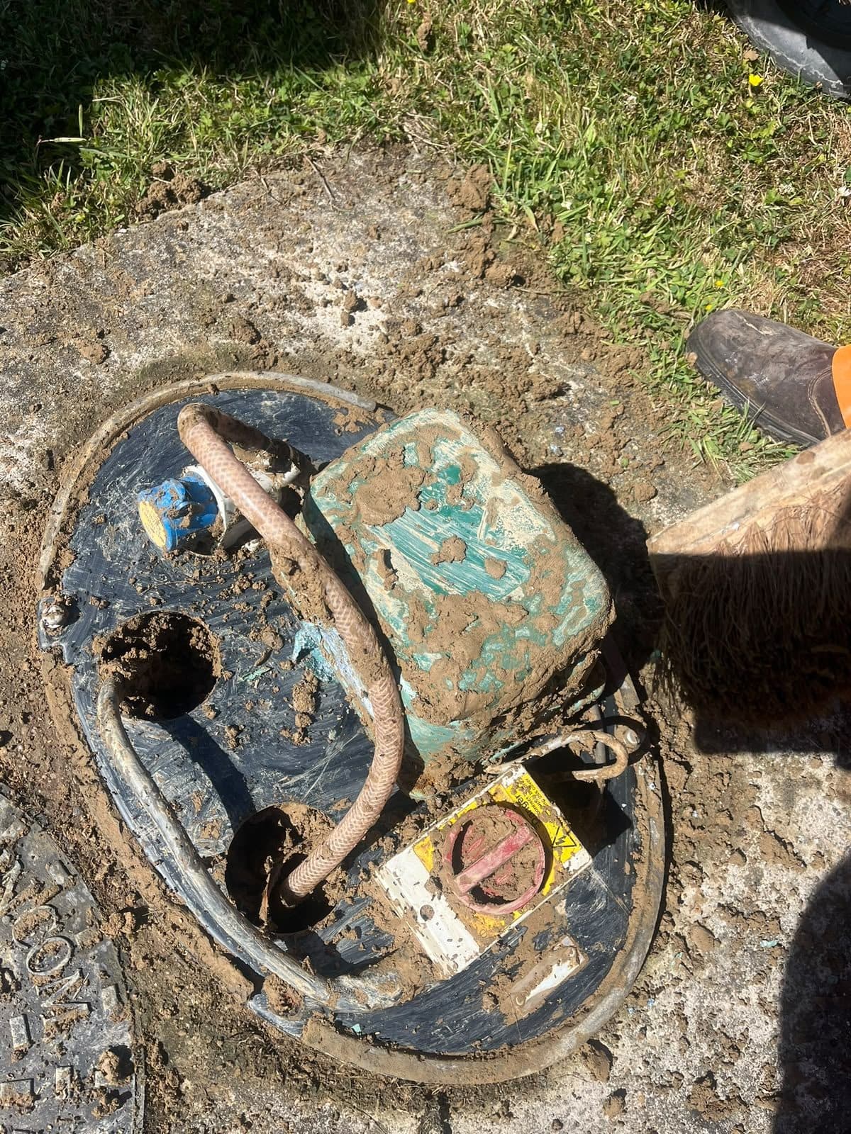 Inspection chamber opened up with the pump control unit sitting inside it