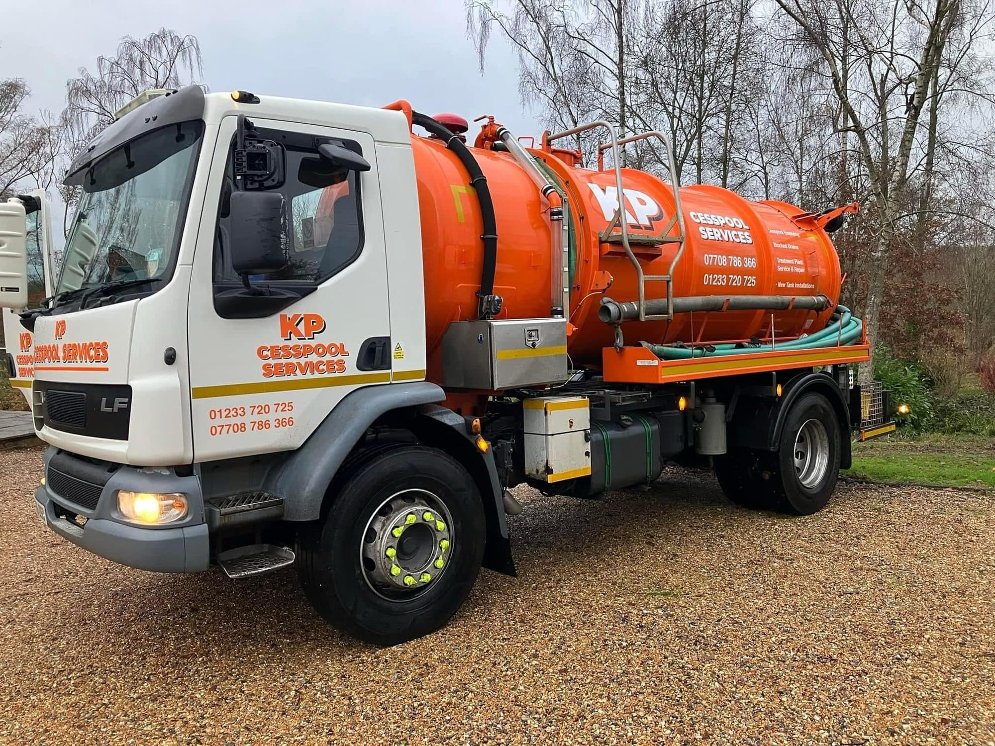 Front view of the KP Cesspool Services DAF vacuum tanker on a gravel drive