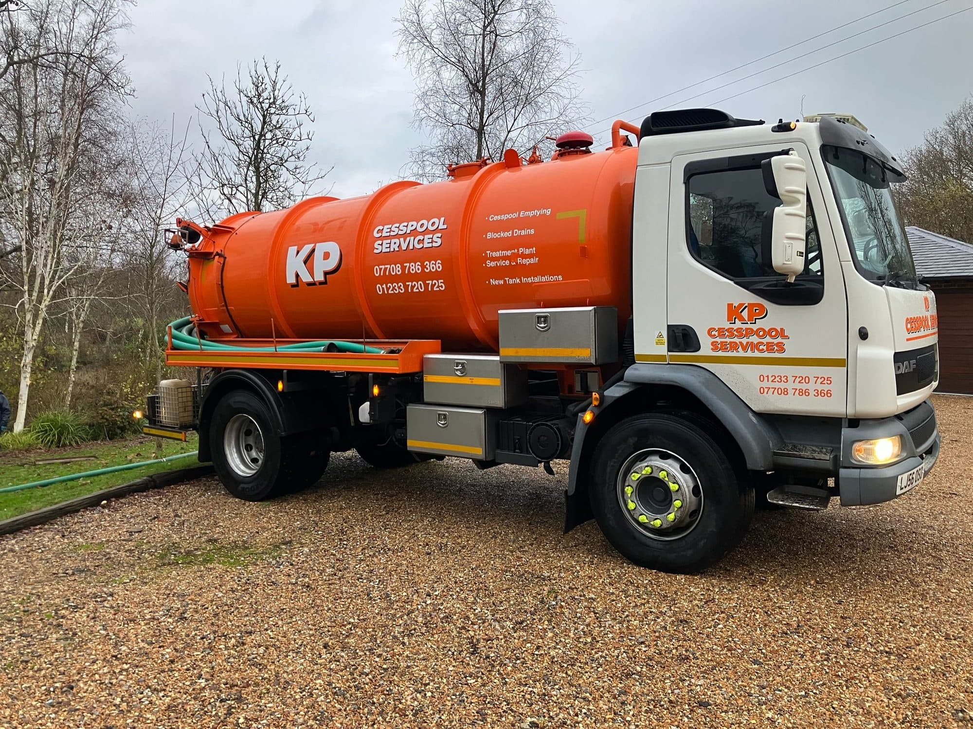 KP Cesspool Services vacuum tanker on a gravel driveway ready to empty a tank